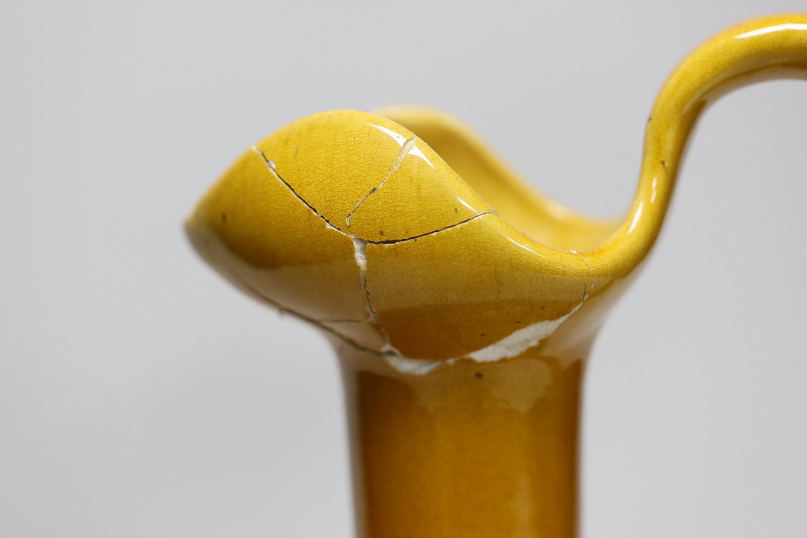 A Bretby ewer in the style of Christopher Dresser, base to top of handle, 31cm high
